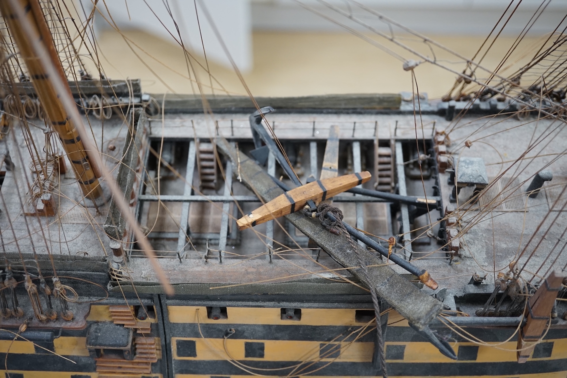 A large model of a rigged ship, 84cm long. Condition - fair